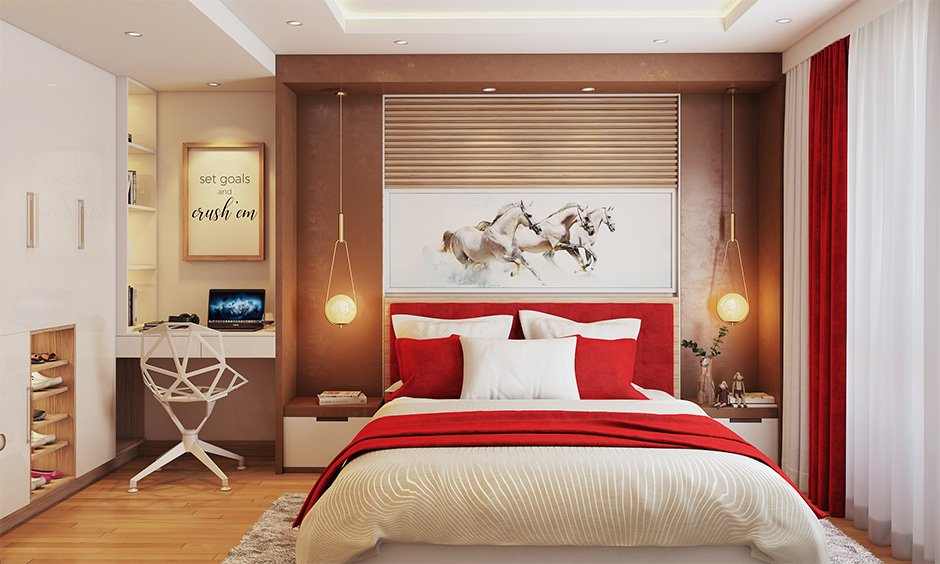 A bedroom with red accents and chairs and deck and wooden floor 