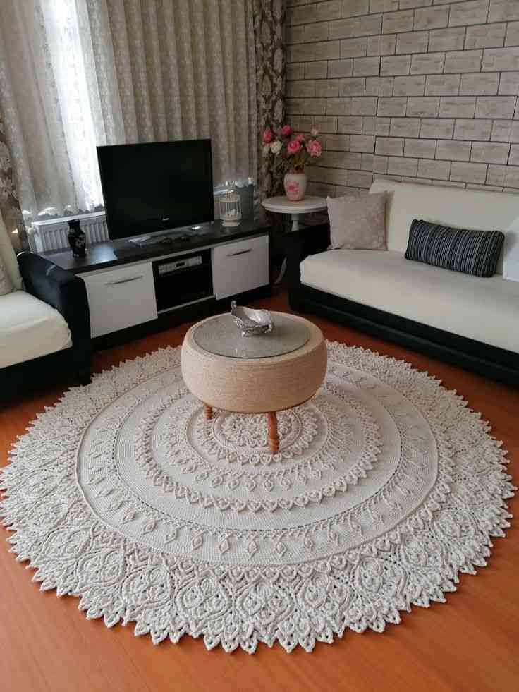 A living room with crocheted doilies on the floor