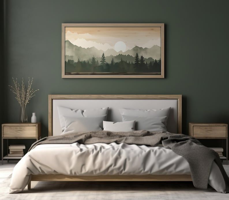 A sage green with grey artwork painting on the wall