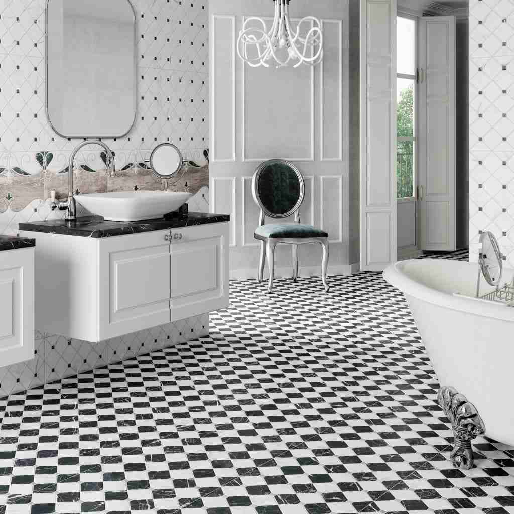 A bathroom with black and white flooring and white basin and black counter top 