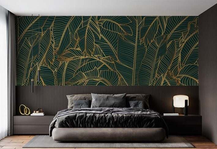 A green bedroom with gold accents wallpaper and wooden floor and rug on it 
