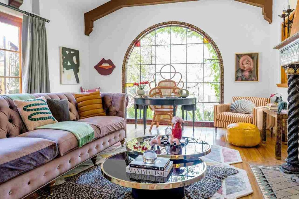 A eclectic-style small living room with windows and wooden floor