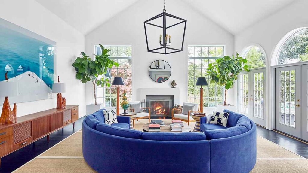 A white room with blue accents and fireplace in room