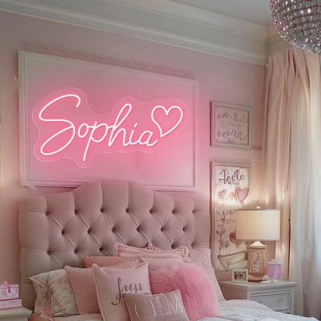 A bedroom with Custom Name Sign in Gold or Neon and side table with lamp