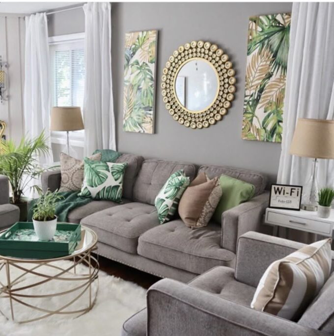 A grey living room with frames on the wall