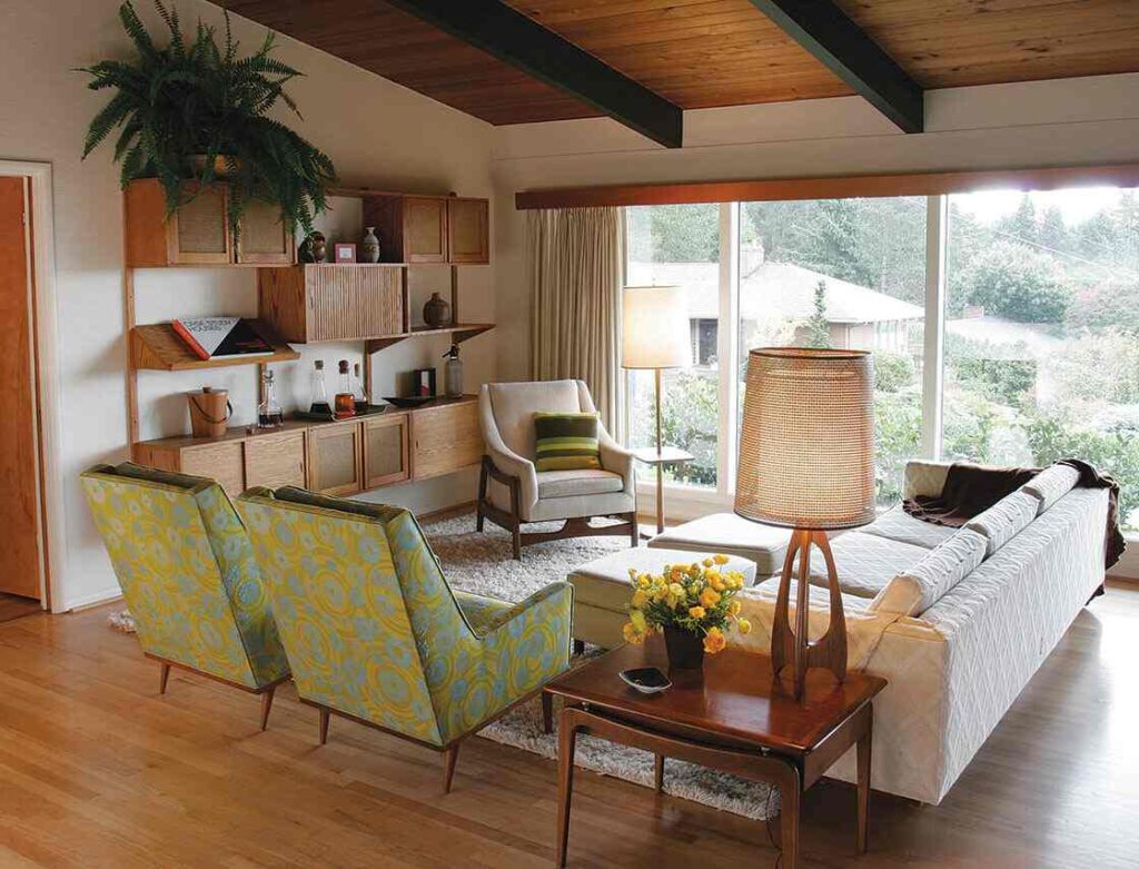 A living room with windows and wooden shelves and wooden celling