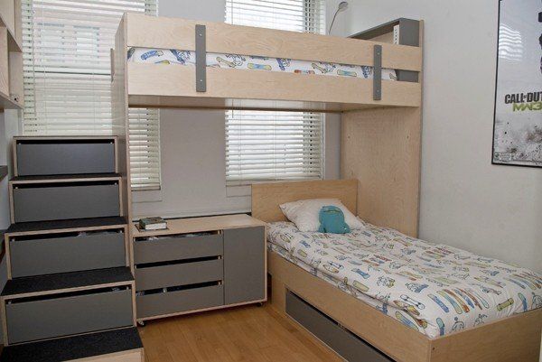 A l-shaped bed and bunk bed and wooden floor 