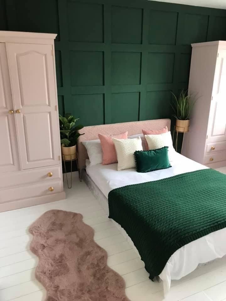 A green bedroom with faux fur in bedroom