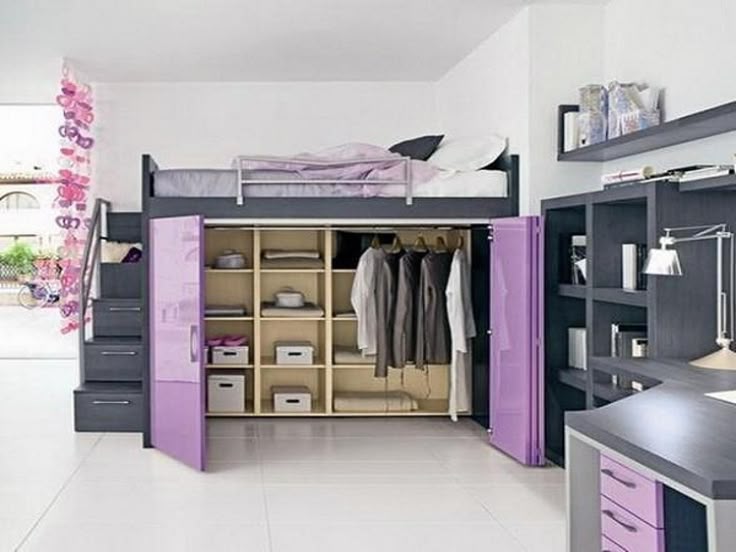 A loft bed with stairs and wardrobe in the room and white floor