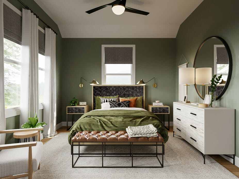 A sage green with metal accents and white dresser with mirror on the wall
