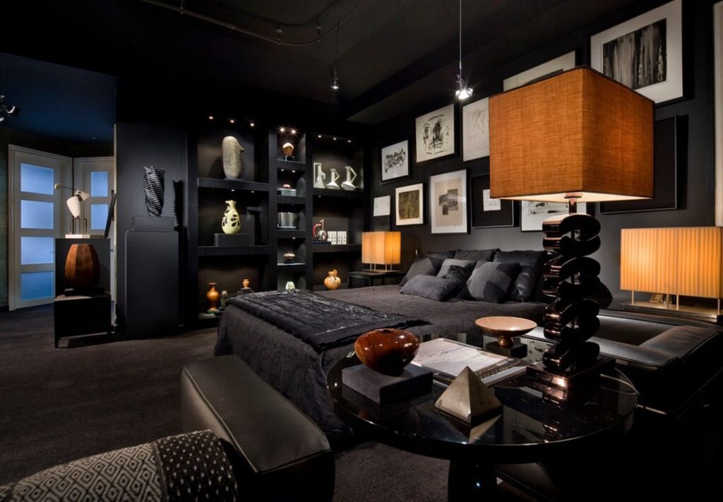 A black bedroom with bold light fixtures