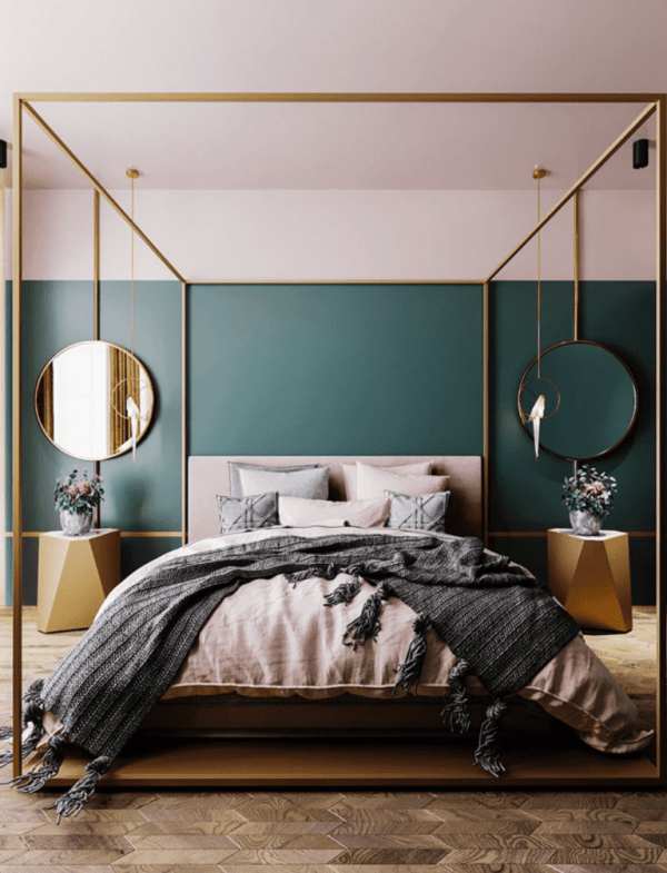 A green and pink bedroom with mirror on the wall and wooden floor 