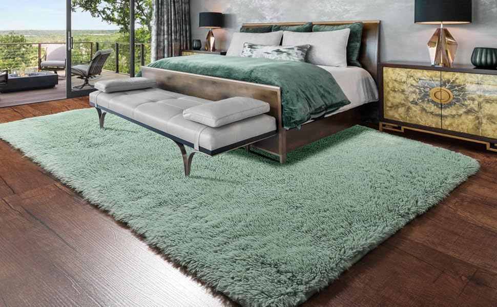Plush layered rugs on wooden floor 