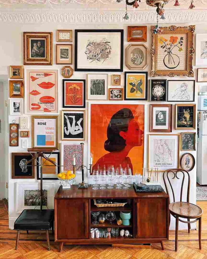 A living room with gallery wall with wooden deck and chair