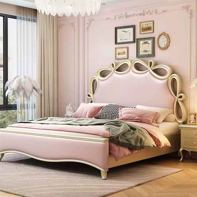 A pink bedroom with tufted bed and wooden floor