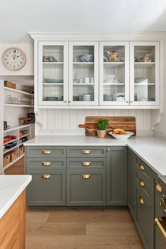 A kitchen and white countertop with wooden floor