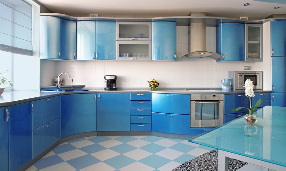 A blue kitchen and blue floor and cabinets