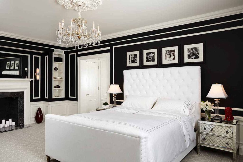 White bed frame and side table with black wall