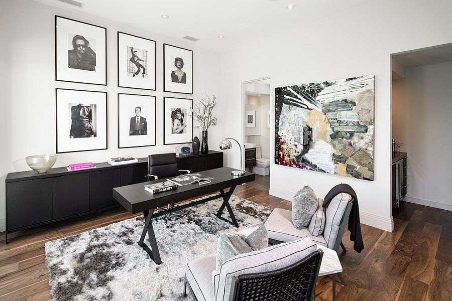 White wall with a black console against it in home  office