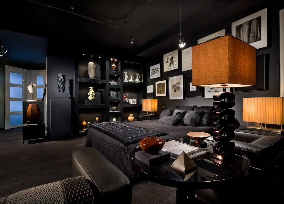 A mens bedroom with work art frames on the wall and lights 