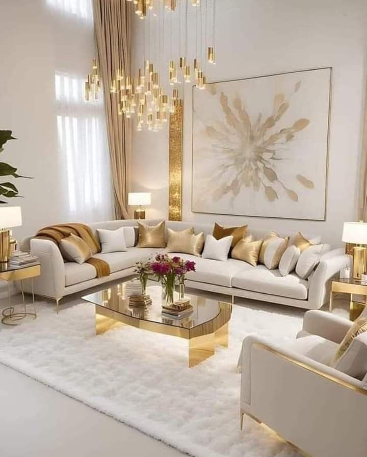 A beige sofa with gold accents in living room and white rug under the table  