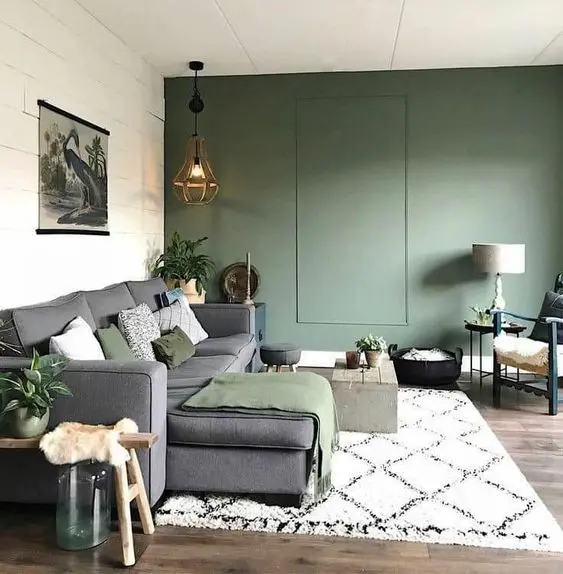 A living room with sofa and wooden floor on rug