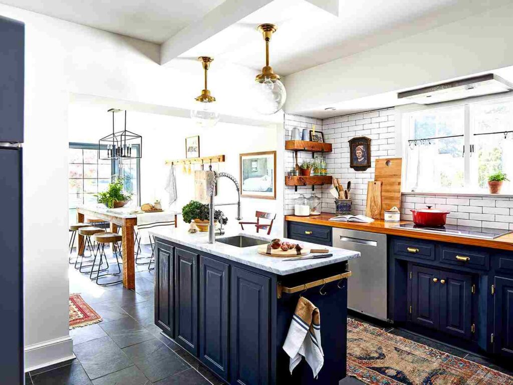 A white and blue kitchen and wooden open shelves