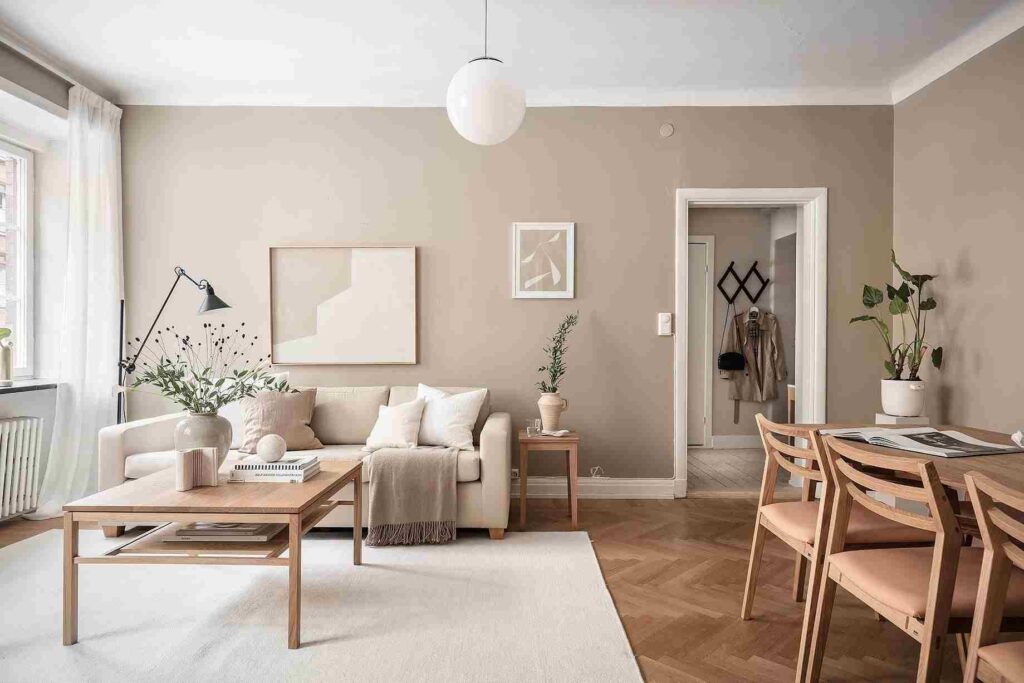 A beige and wooden accents and painting on the wall 