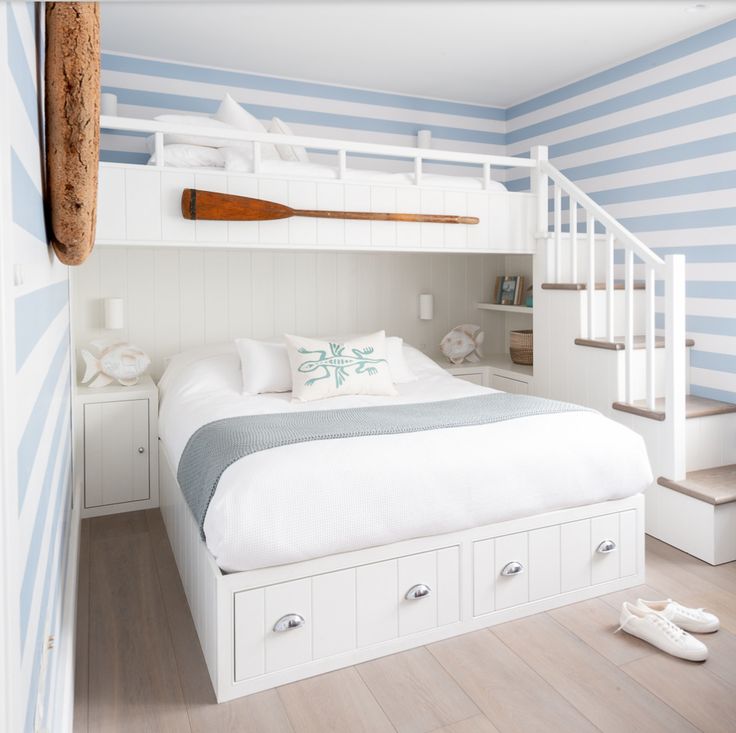 A low height lots bed in bedroom with stairs