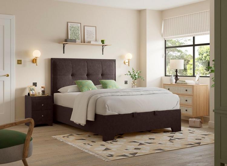 A brown bedding with beige accents and windows 