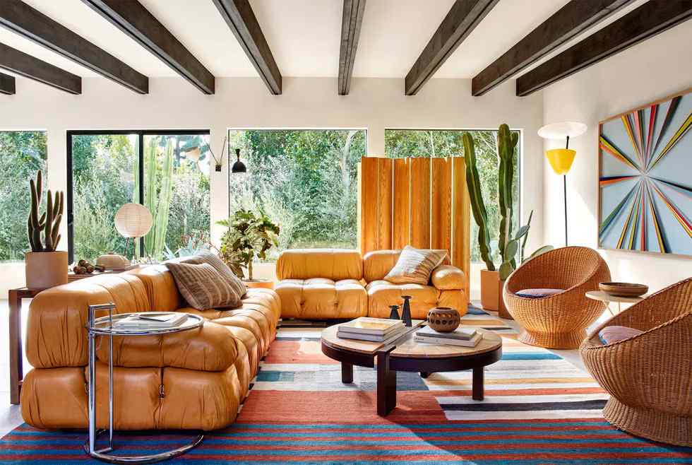 A mid century living room with sofa and wood table