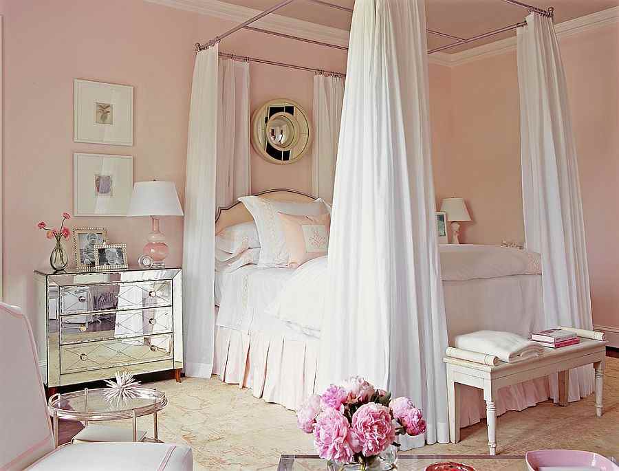 A pastels pink room with white trim and wooden floor