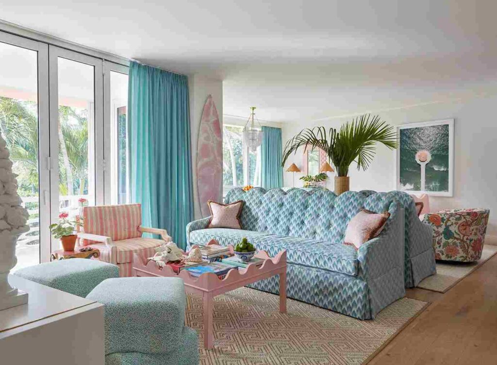 A living room with sofa and table and and rug on wooden floor