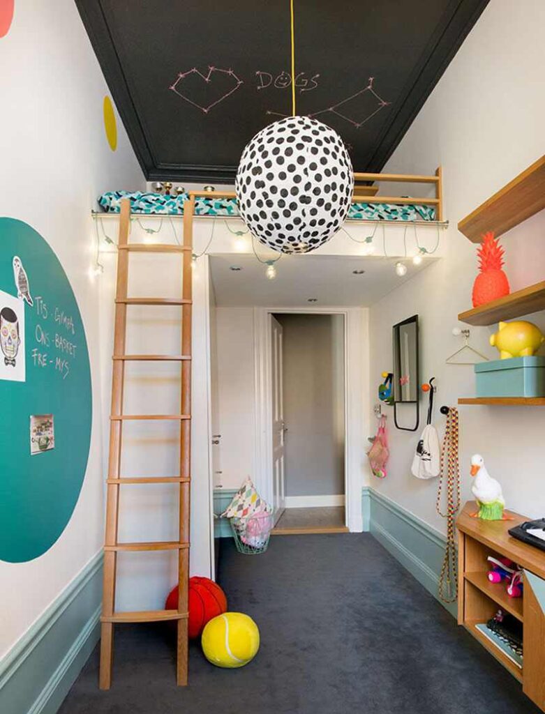 A room with play area and loft bed