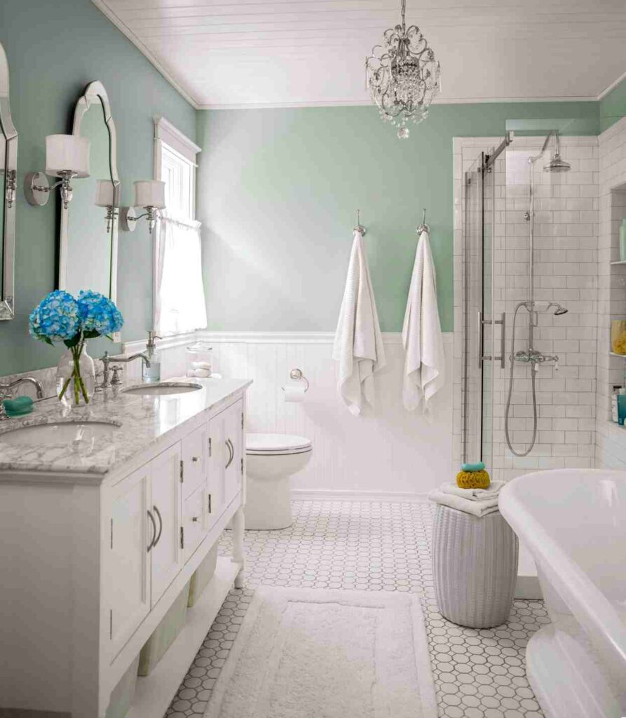 A pastel and white bathroom with white floor and white dresser