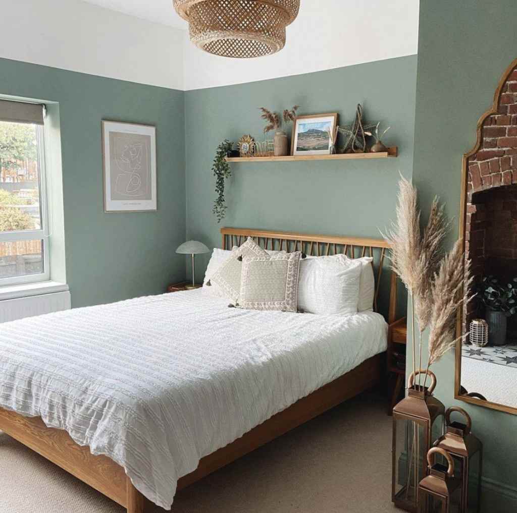 A sage green with with wooden floating shelve