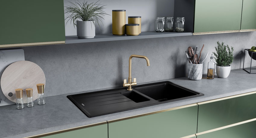 A sage green kitchen and black metals
