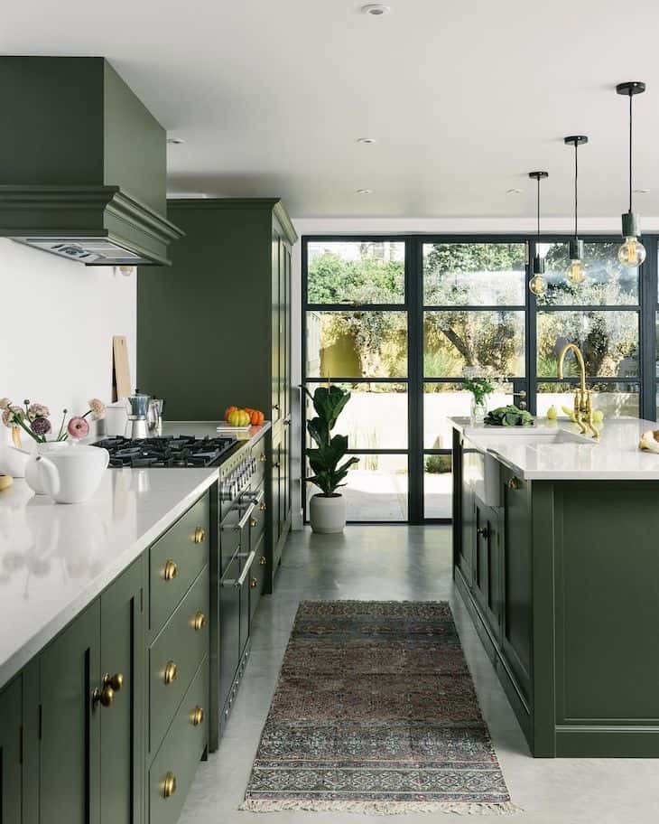 A sage green kitchen and green bead board
