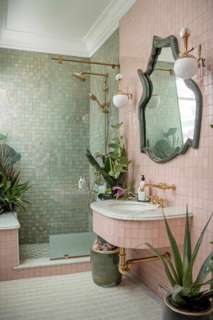 Pink and green bathroom with gold shower kit and plants in the bathroom