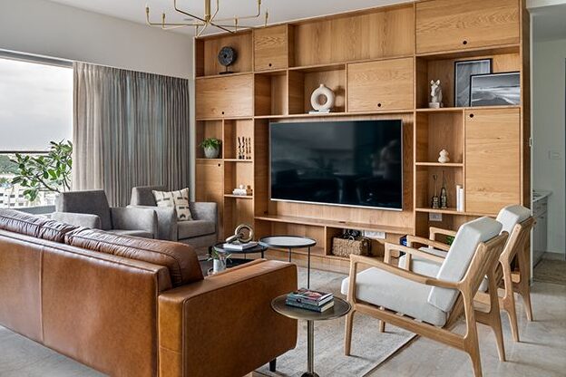 A small living room with mounted wall and sofa and table