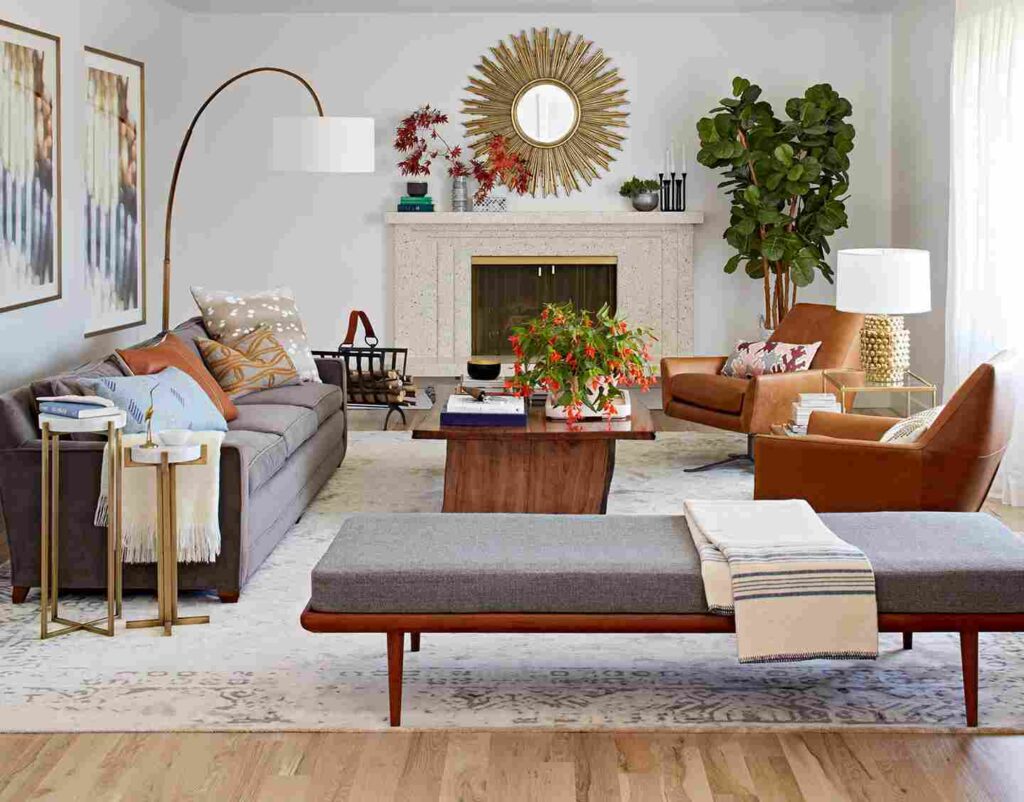 A small living room with metallic accents and wooden table and floor and rug on it
