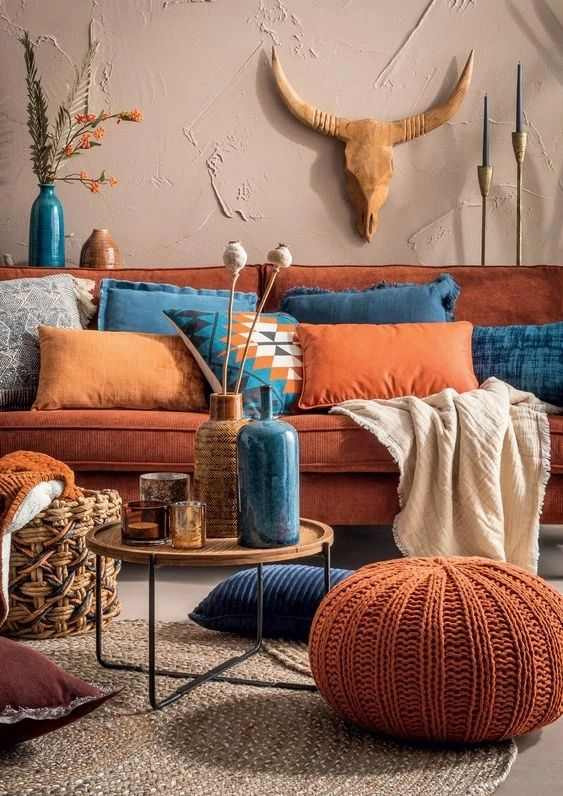A boho living room with terracotta accents
