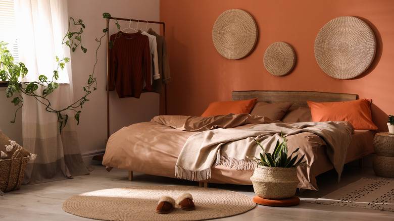 A terracotta with light brown and wooden floor 