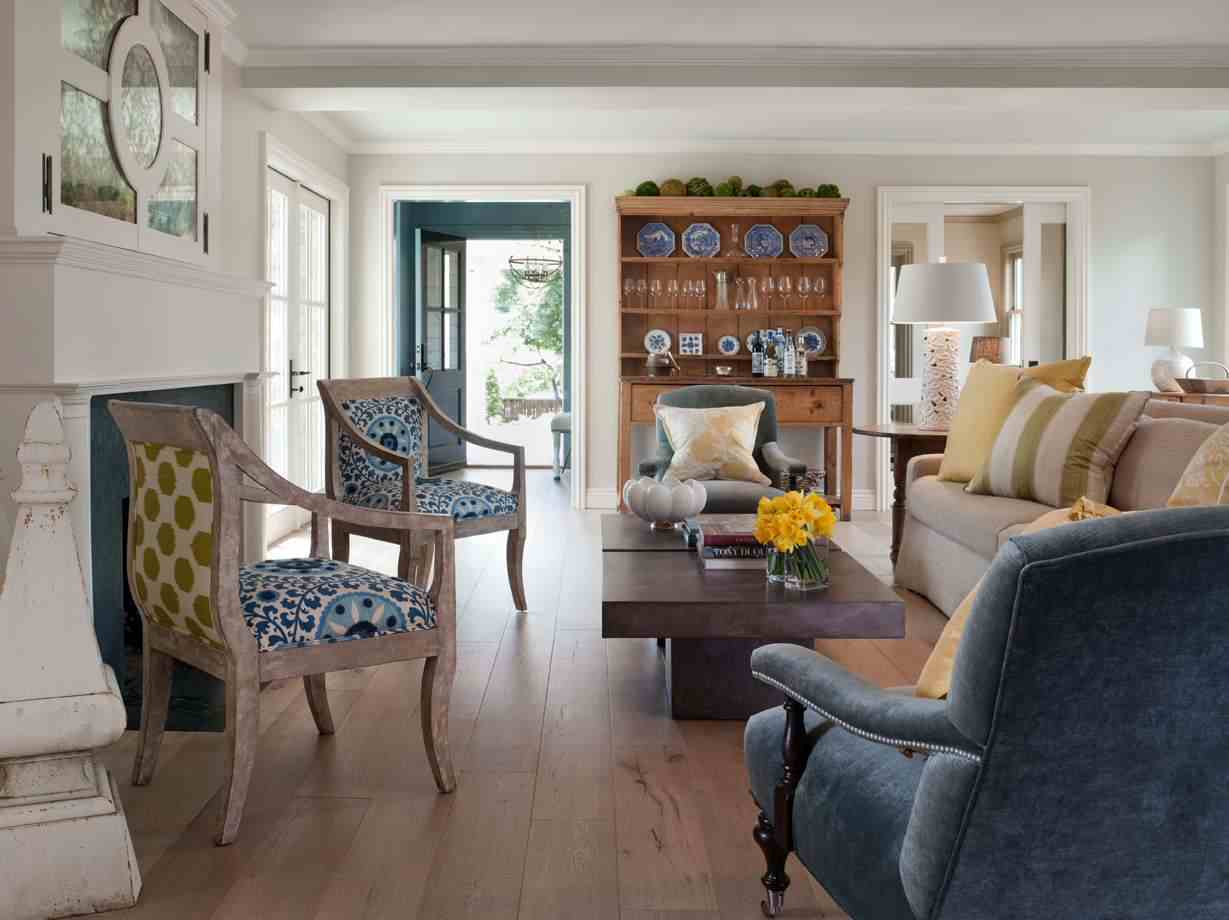 A upholstered chair with textiles and wooden shelves