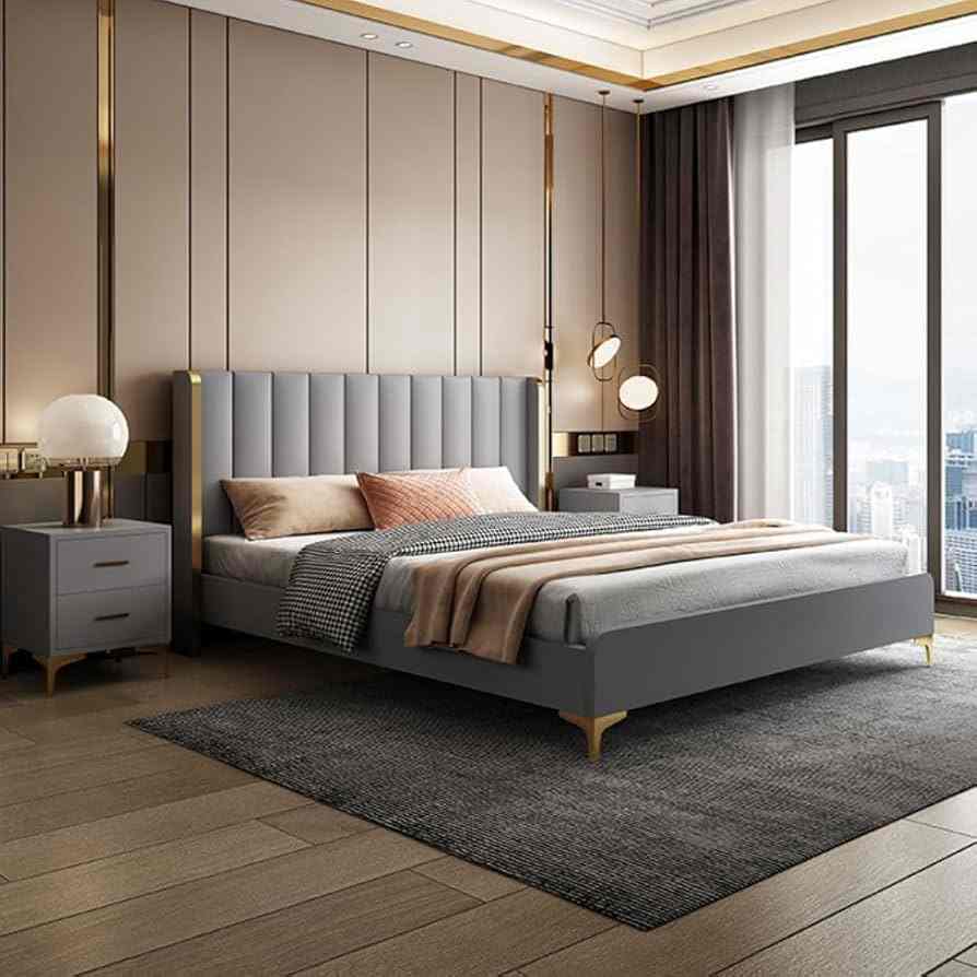 A brown bedroom with upholstered suede headboard and wooden floor