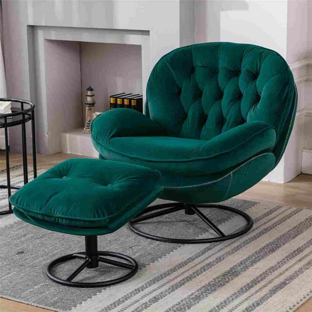 A velvet green armchair with ottoman with wooden floor and rug on it 