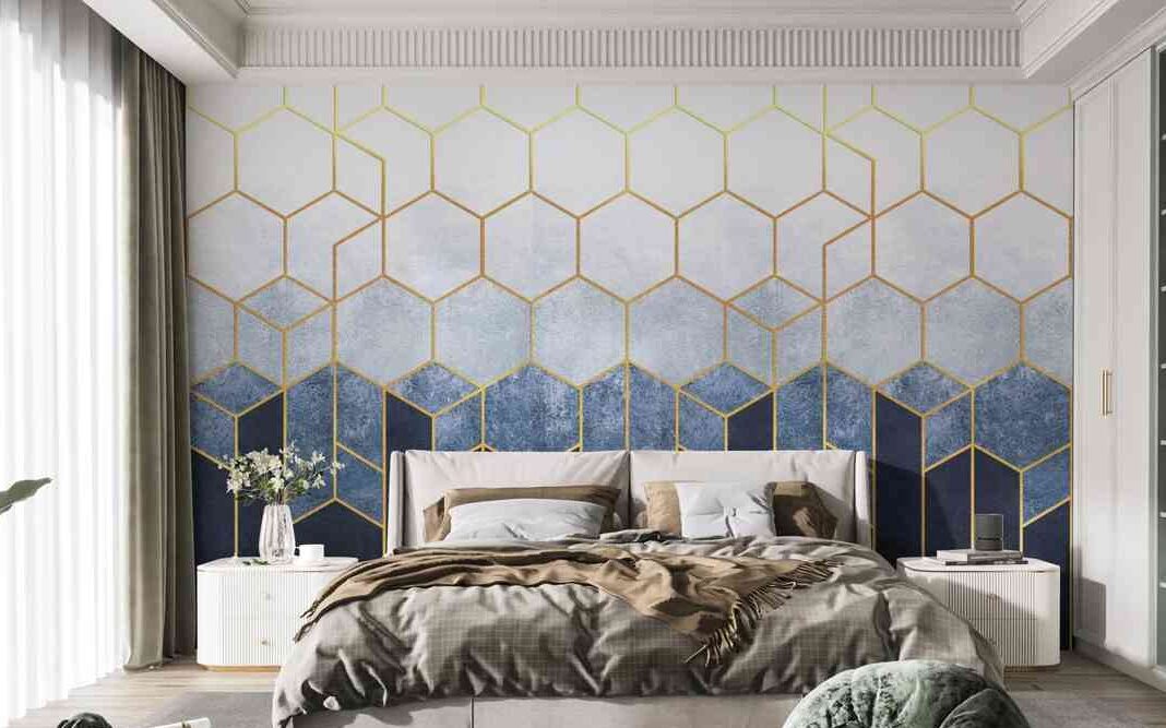 A bedroom with wallpaper and side table with bed