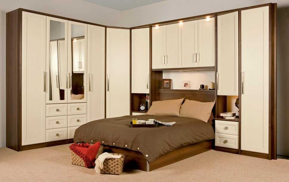 A bedroom with wooden wardrobe and wooden bed