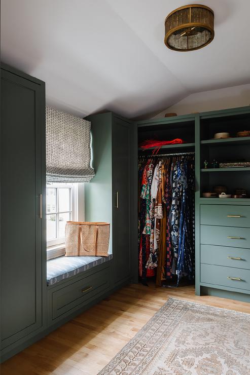 A green closet with wooden floor and window 
