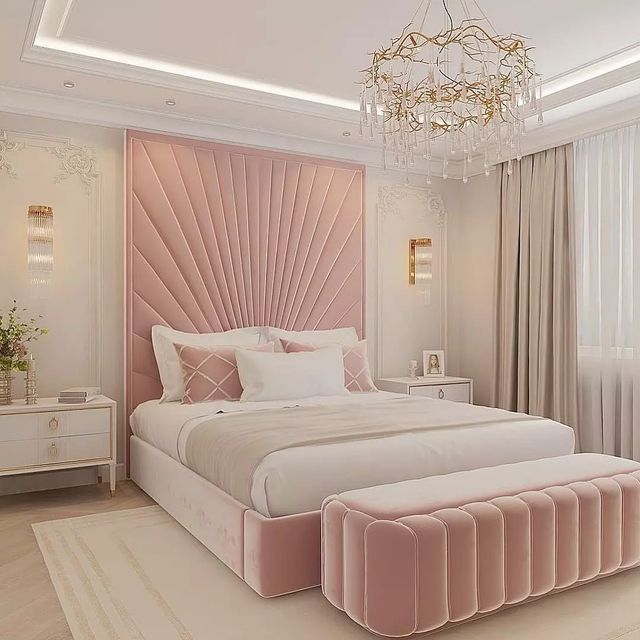 A pink bedroom with Crystal chandelier and pink nightstand